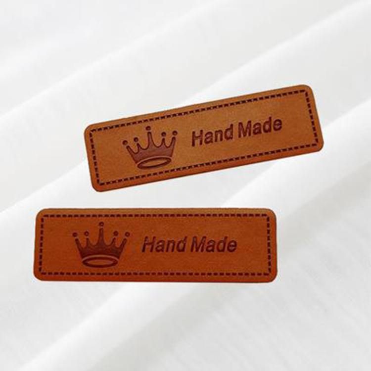 Fashion Design Custom Badge Brand Name Logo Embossed PU Faux Leather Labels Dog Label Private Custom Patch Hang Tag Wholesale